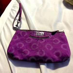 Raspberry colored monogrammed Coach wallet wristlet used a few times